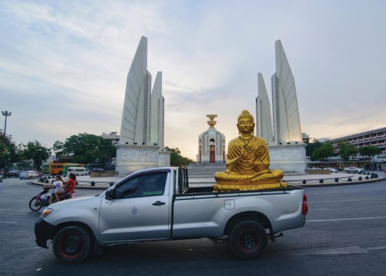 Buddha statue in front of Democracy Monument, buddhism democratic